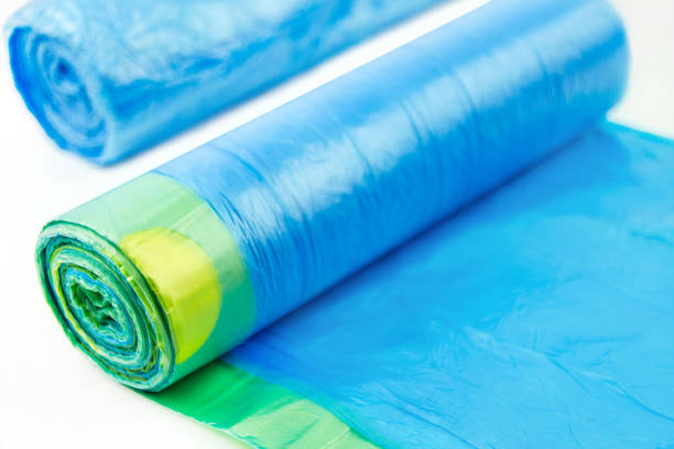 istock Two blue garbage bags on white background 1414788220