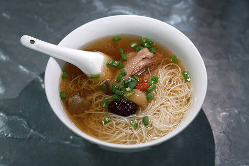Thin rice noodle are served with flavourful broth made of Chinese herbs and topped with pulled duck meat.