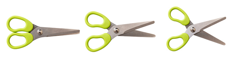 School scissors closed open and wide open, green plastic handle isolated on white. Kids creativity safe tool top view