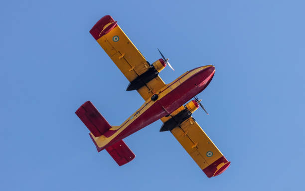 istock Canadair flight, Amphibious Firefighting Aircraft, Scooper on clear blue sky background. Under view 1414791922