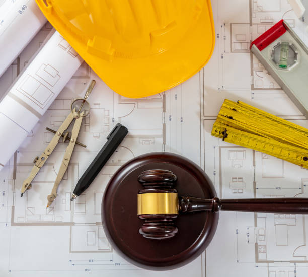 istock Construction and Labor law flat lay. Judge gavel and design tools on building blueprint 1414792212