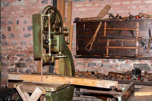 Interior of grist mill showing the hopper for funneling and guiding grain into the grind stone area.  Taken at historic Waterloo Village, NJ.