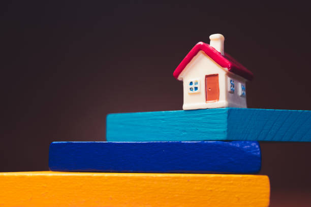 istock Miniature house on tangram puzzle 1414795835