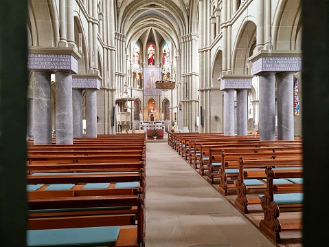 Interior of  the Church of St. Peter and Paul in Bern City. The church was realized between 1858 and 1864 and planned by Pierre Joseph Edmond Deperthes and H. Marchal. The image shows the main nave of the church.