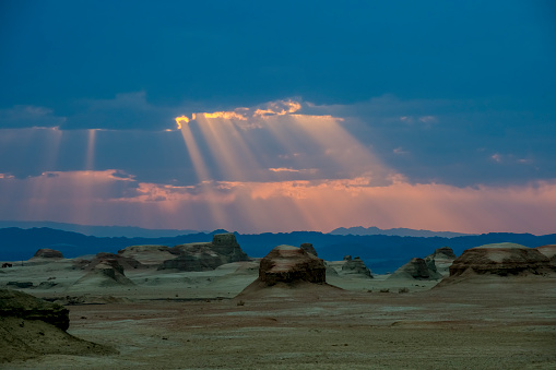 The sun beam cross the cloudy sky at sunset moment, Xinjiang, China