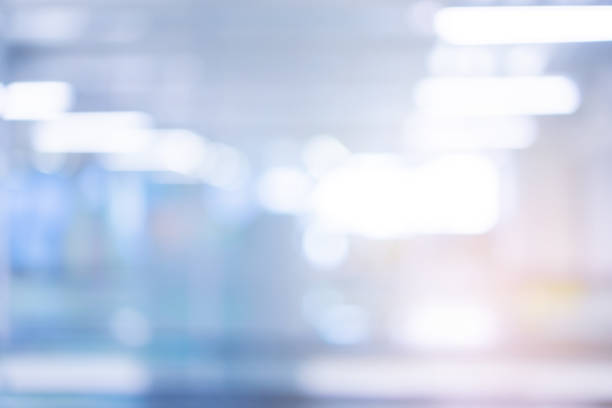 Abstract blurred inside interior of hospital building background with shine light for advertisement design and show content concept