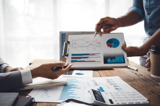 istock Business team meeting and presenting business results discussion and analysis data chart and graph, finance and accounting. Business performance concept. 1414804085