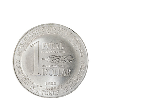 Close up view of on front side  disarmament coins made of metal of (SS-4) Soviet medium range missiles scrapped under Soviet-American INF Treaty.