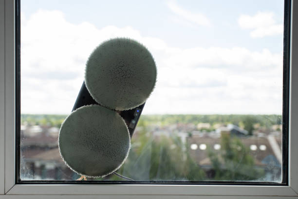 istock robot window cleaner washes glass with round rags, robotic service 1414806932