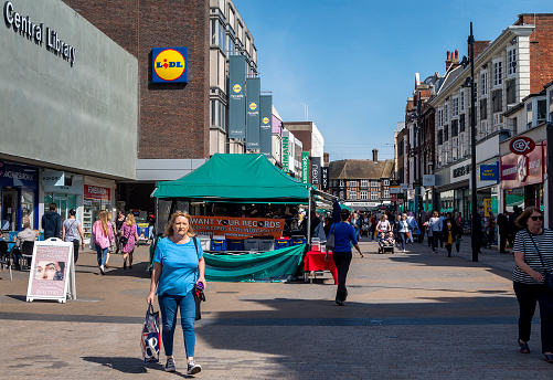 Ashford, Kent, United Kingdom - March 9, 2020: Rotunda on High Street in the pedestrianised town centre with shops in Spring