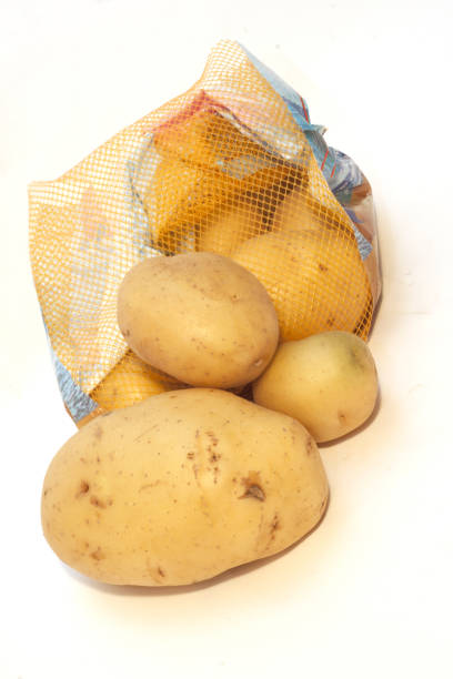 istock yellow pasta potato tuber with red net bag 1414812345