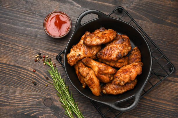 istock Spicy chicken wings with ketchup 1414813622