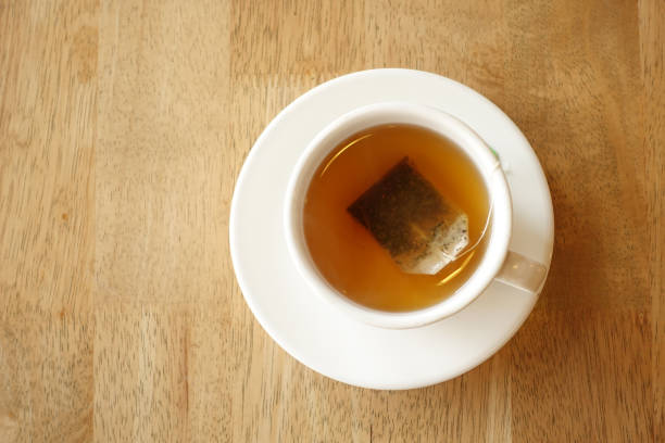 istock green tea with tea bag on tiles background 1414818486