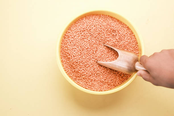 istock Bowl of uncooked dhal on white, 1414818739