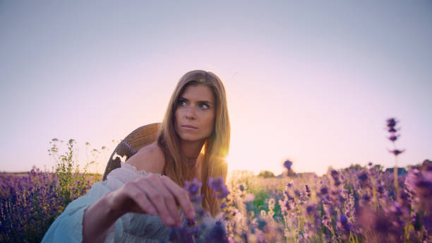 istock Looking for inner peace. Woman picking lavender flowers 1414823085