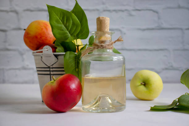istock Apple cider vinegar in a bottle, fresh apples 1414824879