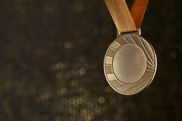 istock gold medal with bokeh background 1414825668