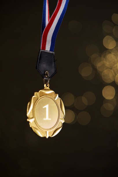 istock gold medal with bokeh background 1414825673