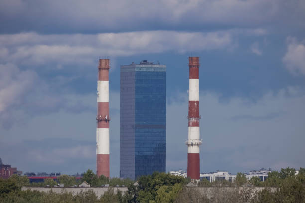 istock High-rise building between two industrial pipes 1414825683