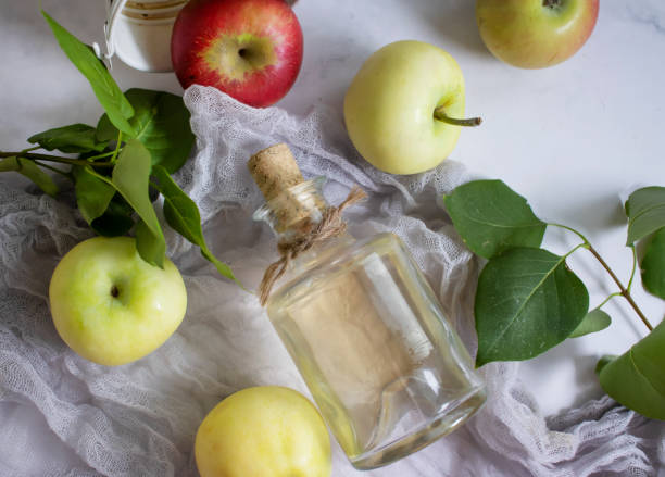 istock Apple cider vinegar in a bottle, fresh apples 1414825913