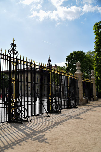 Shadows of the gate of Luxembourg Garden in Paris