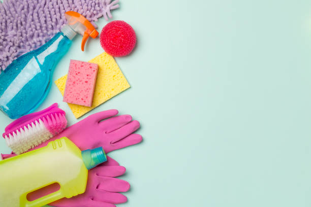 istock Many different house cleaning products on color background, top view 1414829904