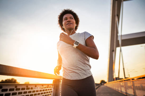istock Young African American woman jogging 1414833391