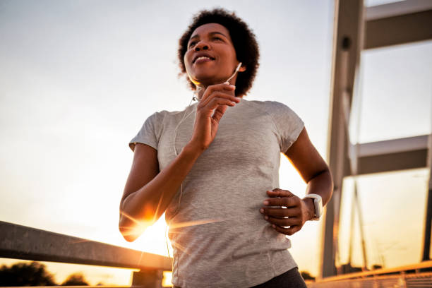 Jogging across the bridge at sunset