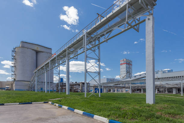 Summer view of big chemical plant. Summer view of big chemical plant. Production of nitrogen fertilizers. Blue sky on the background. ammonia fertilizer stock pictures, royalty-free photos & images