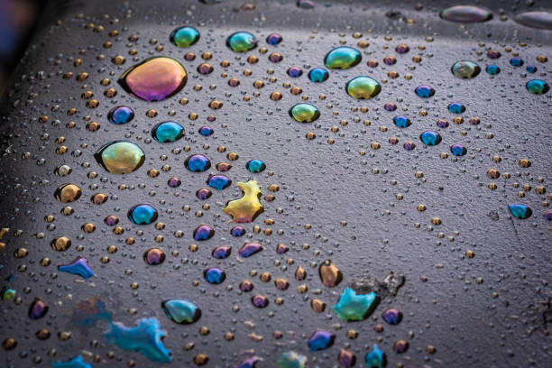 Water drops on a waste oil container turned colours