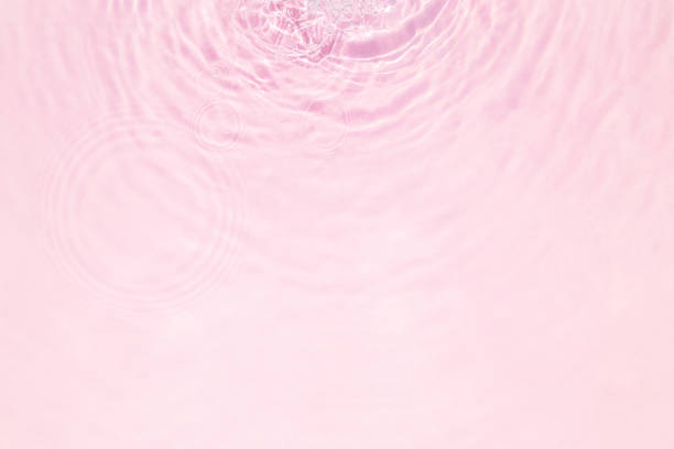 istock Closeup of pink water surface texture with splashes and bubbles 1414845277