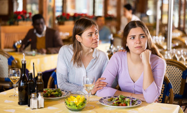 istock Quarrel of two friends during dinner in restaurant 1414845608