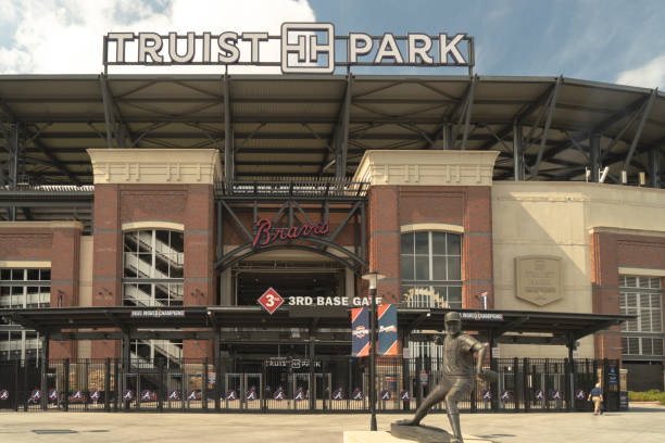 Truist Park Stadium- home field of Atlanta Braves Atlanta, GA, USA: August 13, 2022-An entrance to Truist Stadium in Atlanta, Georgia. The stadium is a ballpark and the home field of Atlanta Braves -Major League Baseball team champion of 2021. american league baseball stock pictures, royalty-free photos & images