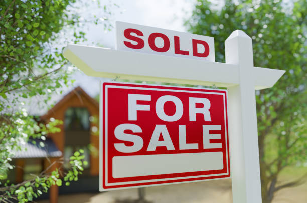 For Sale Real Estate Sign In Front of Property. stock photo