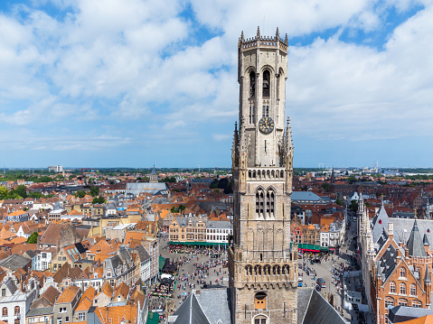 Aerial view on Bruges belfry and the town, in Belgium. May 27, 2022