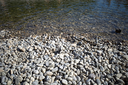 Pebbles by river side. It was a day time in summer.