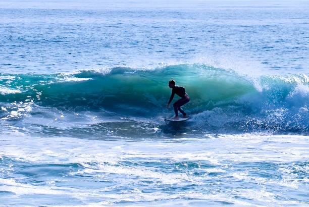 istock Surfer at the bottom of translucent wave 1414855250