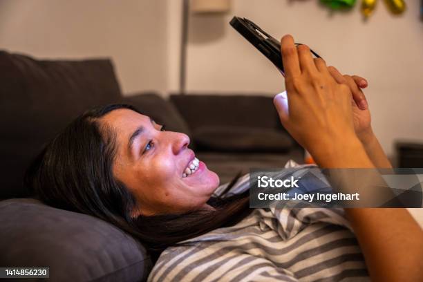 Beautiful Women With A Happy Reaction To What She Sees On Her Phone Stock Photo - Download Image Now