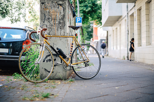 Parked bicycles in Berlin residential area of Neukölln in the summer.