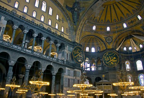 Istanbul, Turkey - 09.09.2022: tourists visiting the interior of Aya Sophia - ancient Byzantine basilica. For almost 500 years the principal mosque of Istanbul, Hagia Sophia served as a model for many other Ottoman mosques