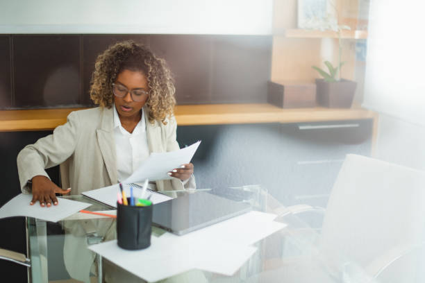 istock woman concentrated on work in the office 1414863105