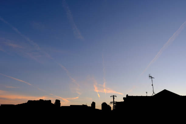 Contrails and blue sky over Yamashina at dusk (horizontal) stock photo