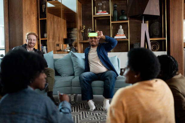 istock Friends playing guessing game at home - including a person with special needs 1414871547