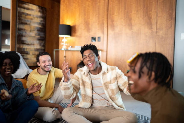 istock Friends playing guessing game at home 1414872062