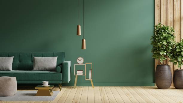 istock Living room with green sofa on empty green wall background. 1414872907