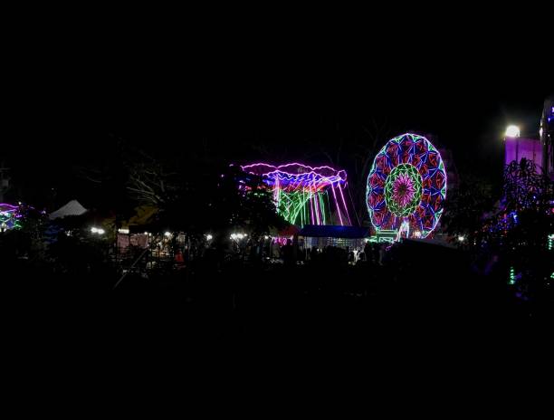 istock Windmill rides at the night market 1414872958