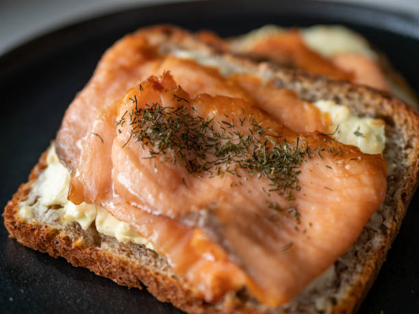 Cooked salmon and cheese on toast bread
