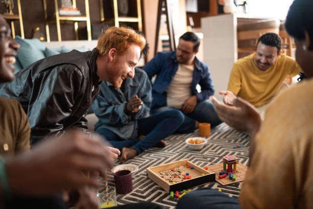 istock Friends playing board game at home 1414873851