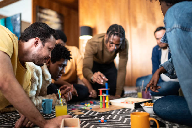 istock Friends playing board game at home 1414873860