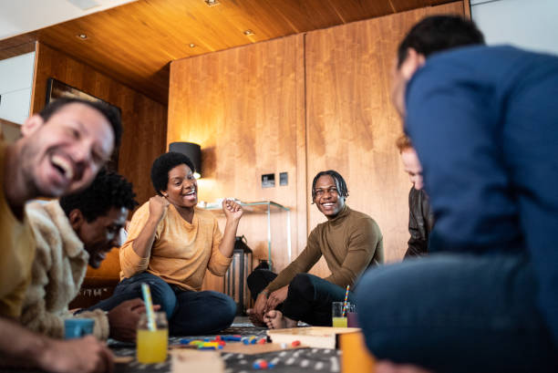 istock Friends playing board game at home 1414873866